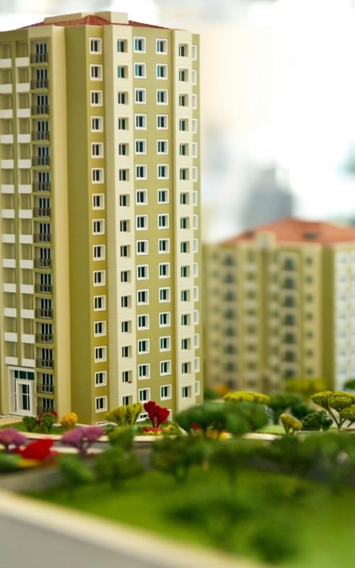 Close-up image of a modern residential building model, showcasing urban architecture.